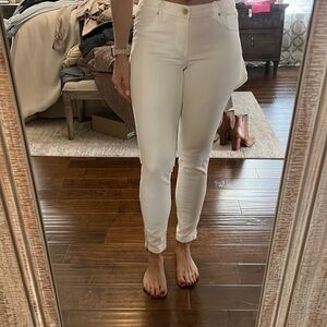 White denim jean leggings with gold zipper detail